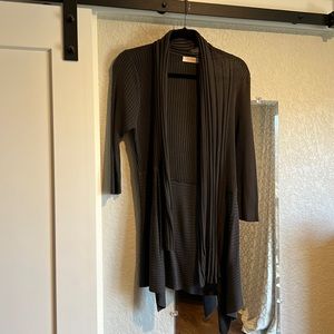 One wrap, two looks! Can be a shrug or a cardi.